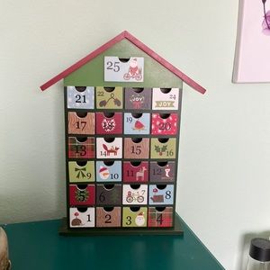 Wooden advent calendar with 25 drawers.